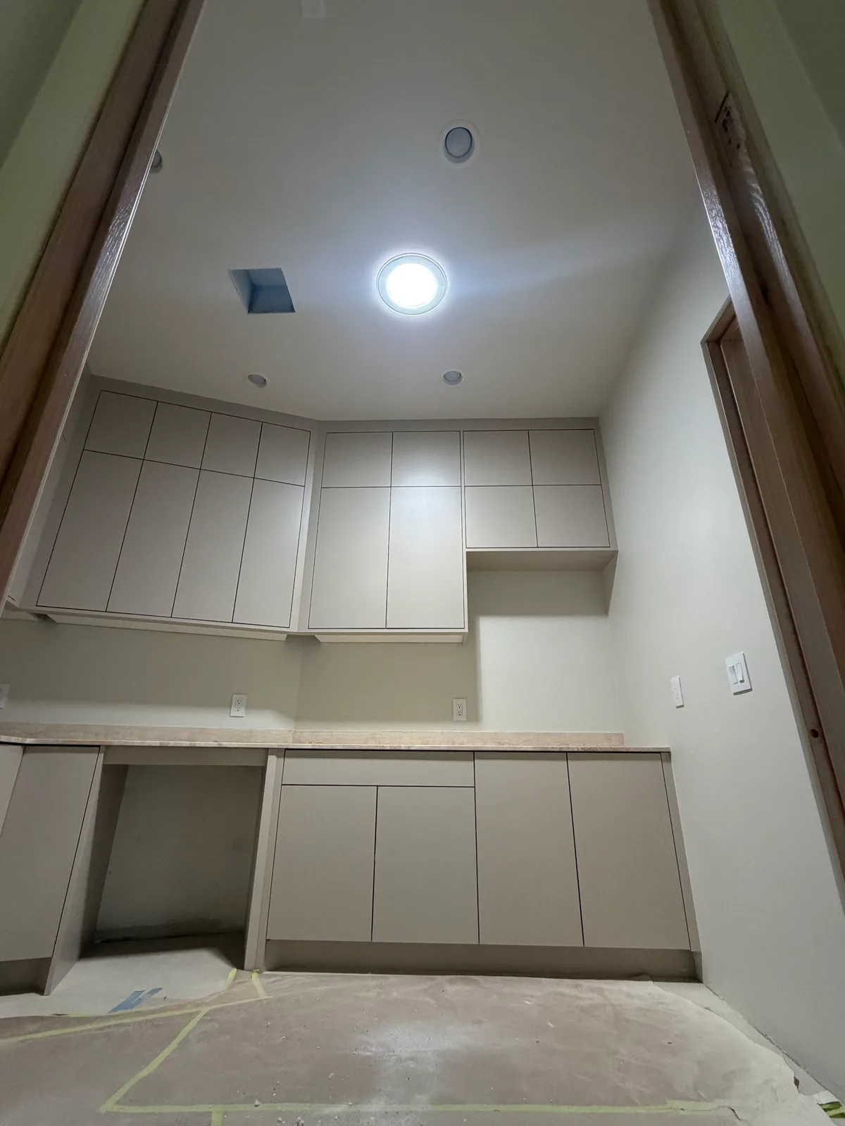 The same laundry room filled with daylight from a VELUX Sun Tunnel