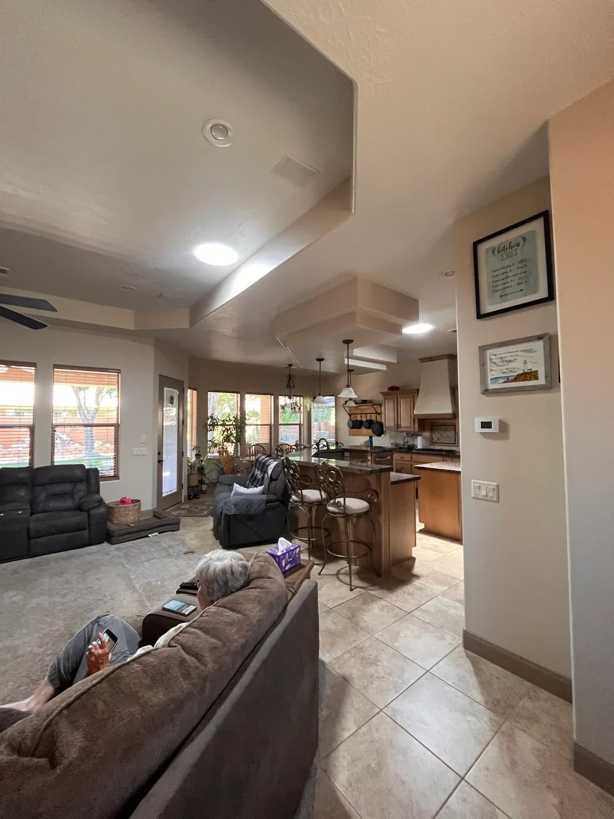 The same living room and kitchen bright with daylight from VELUX Sun Tunnels