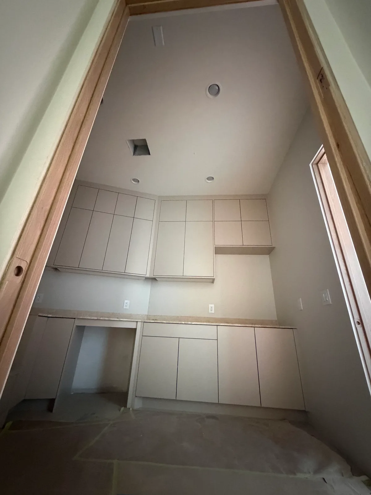 Laundry room dark in the middle of the day before a sun tunnel was installed
