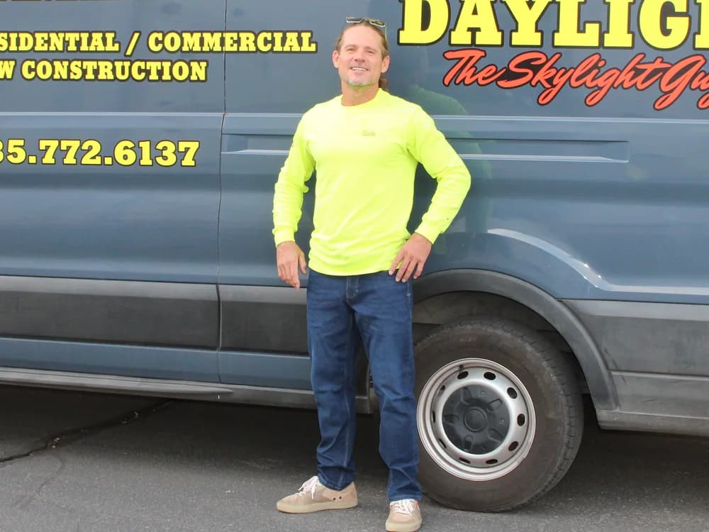 Wade Knight, CEO and co-founder of Desert Sky Daylight, beside the company van in Washington, Utah